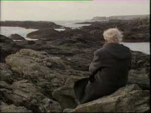 RS Thomas in a Welsh landscape seen on the back